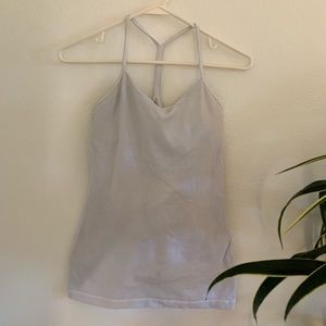 white tight fitting lululemon tank